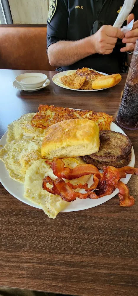 3 Eggs over Easy Sausage Bacon Biscuit and Hashbrowns